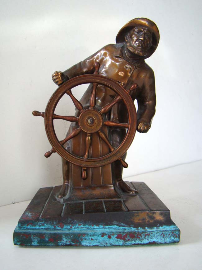 A single bookend depicting a "Captain at the helm" made by Ronson circa 1930